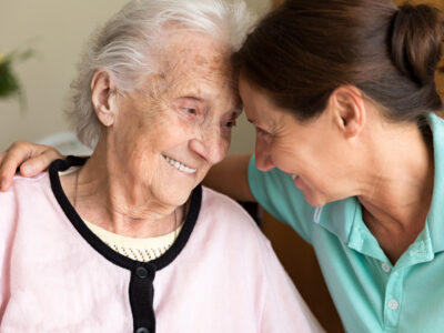 Dementia and Occupational Therapy - Home caregiver and senior adult woman