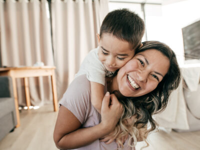 Mom laughing with her son.