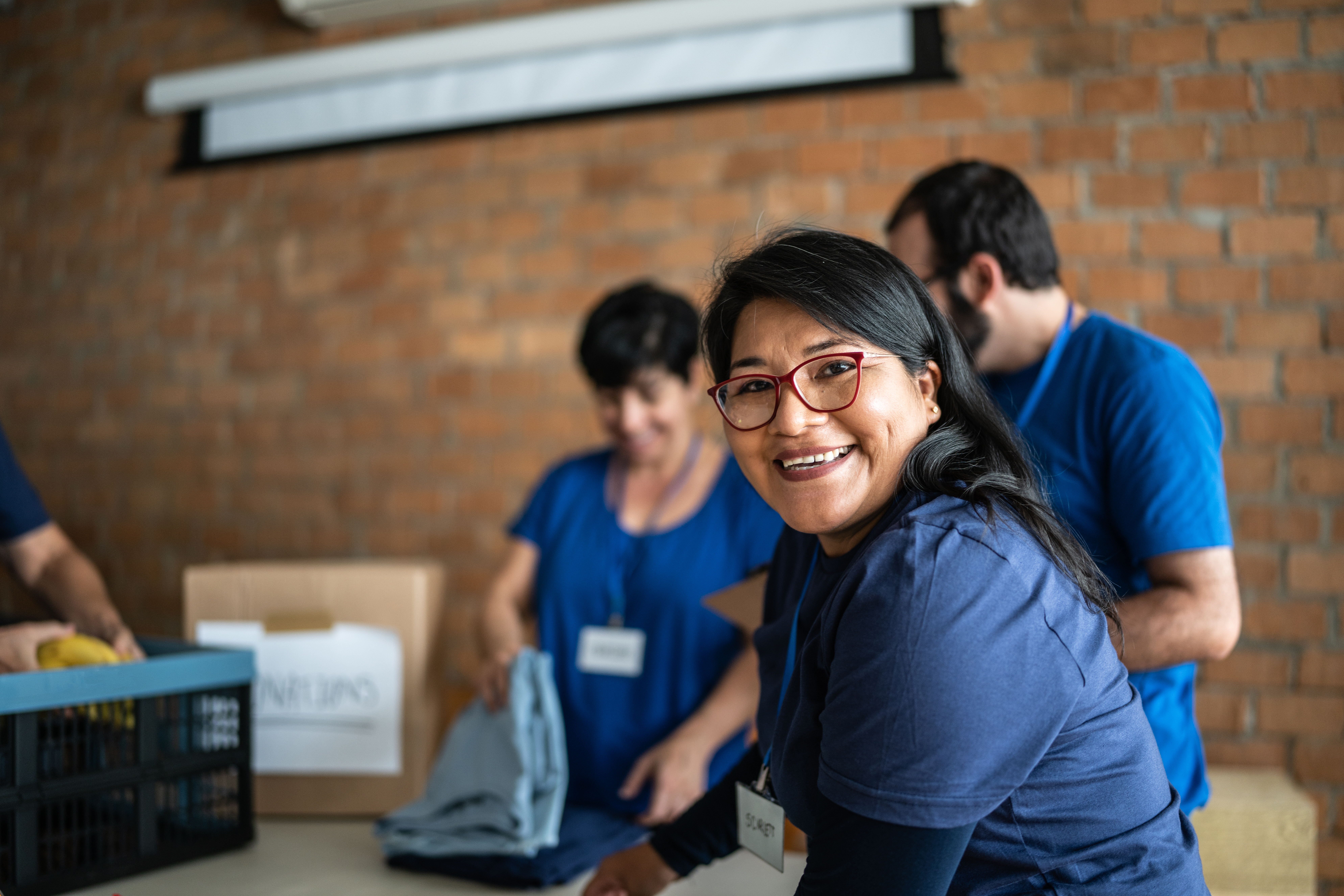 Portrait of a volunteer working in a community charity donation center