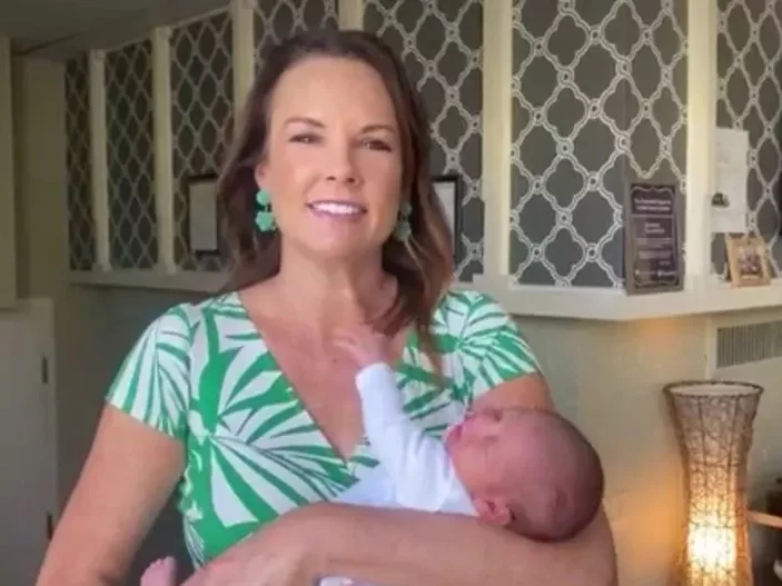 Jennifer is pictured with the 300th baby born at Freedom House.