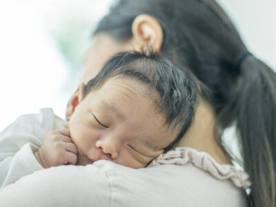 Baby held by Mother